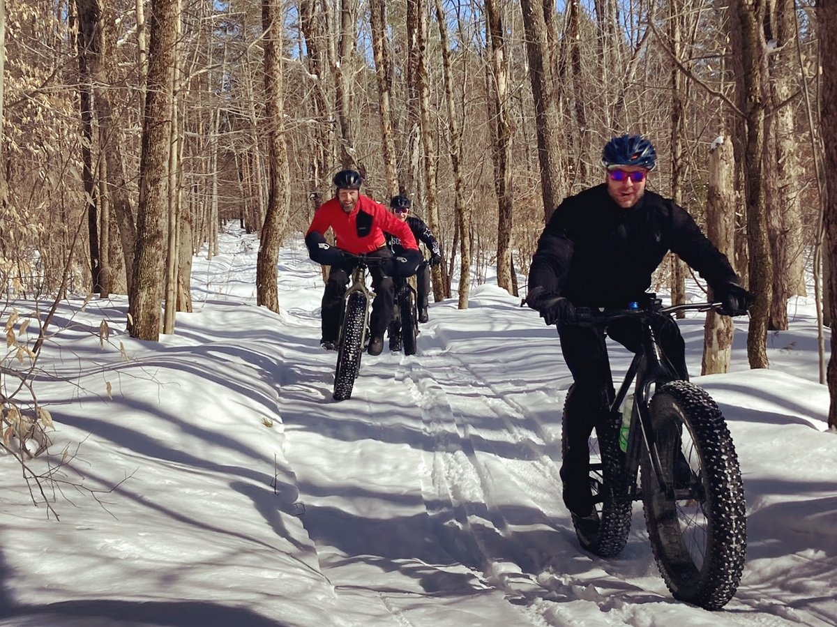 People riding bikes in the snow