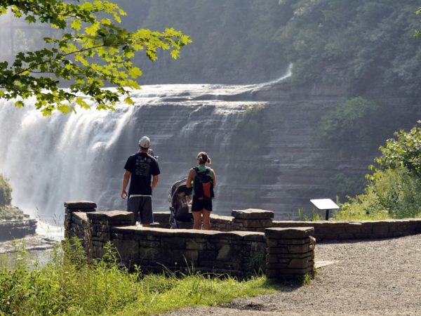 A family looking at a waterfall