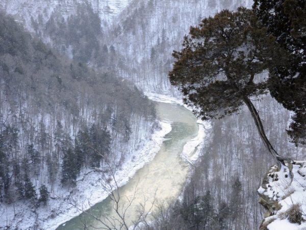 A view of the gorge and river with snowy hills
