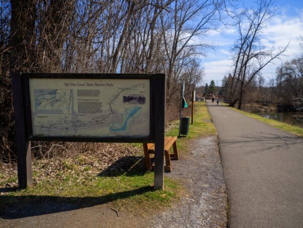 A large sign for the Eric Canal State Historic Park