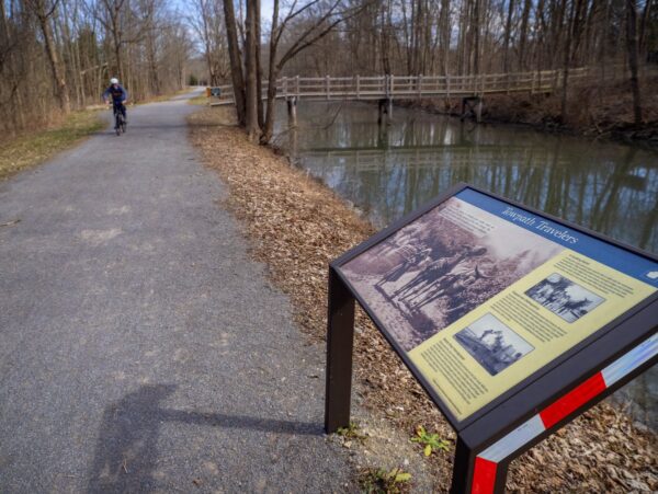 A person riding a bike on a path