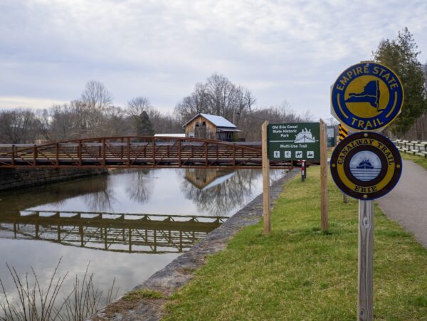 A long bridge that crosses a canal