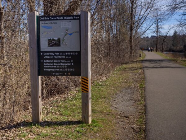 A trail sign with a map