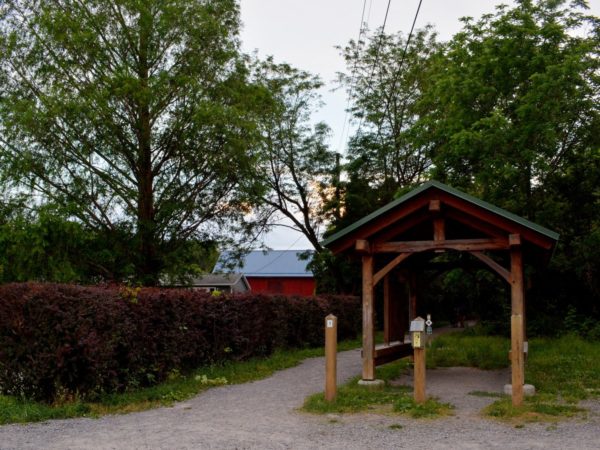 A wooden kiosk and trailhead