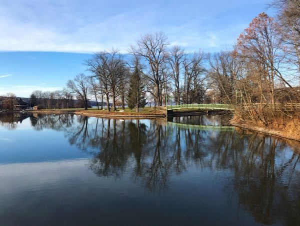 A view of a footbridge Stewart Park from across the water