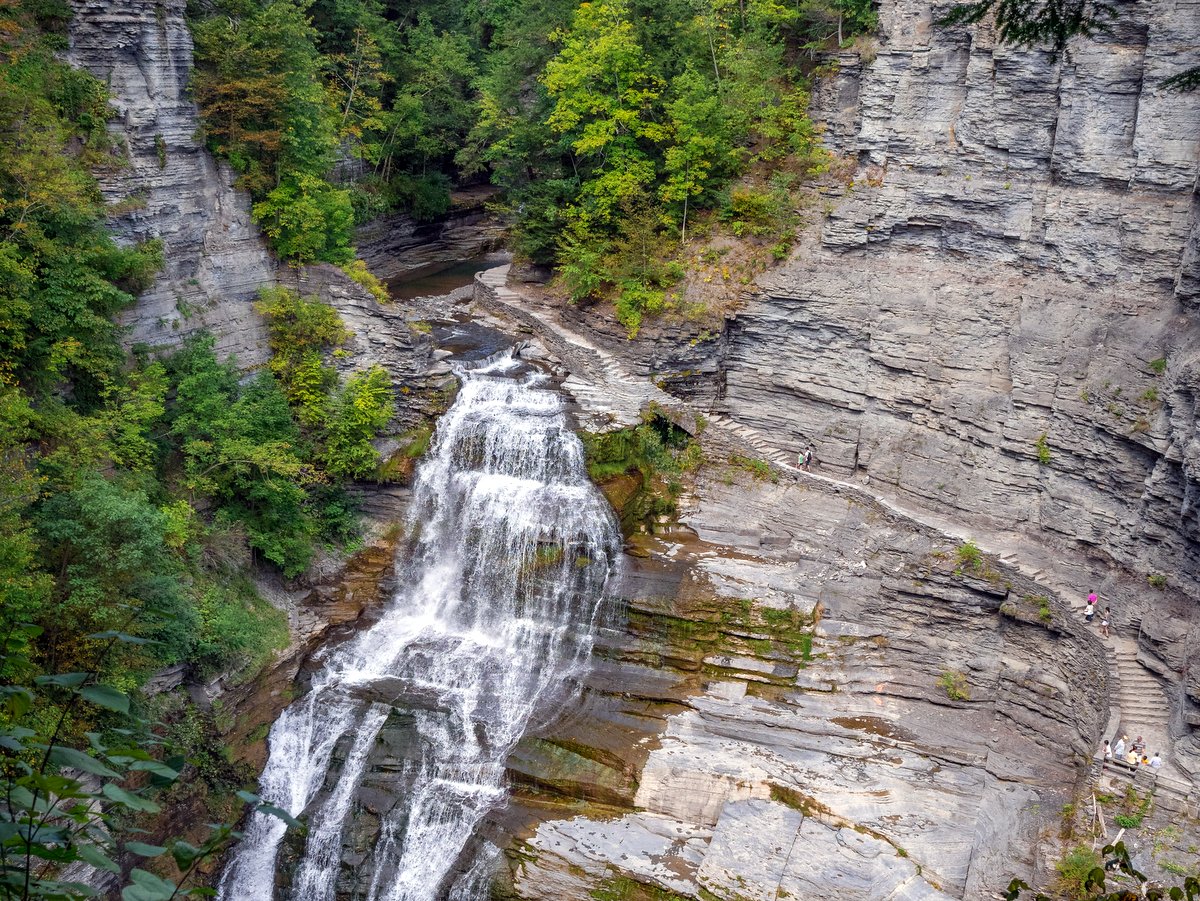 A waterfall and gorge with a stone staircase